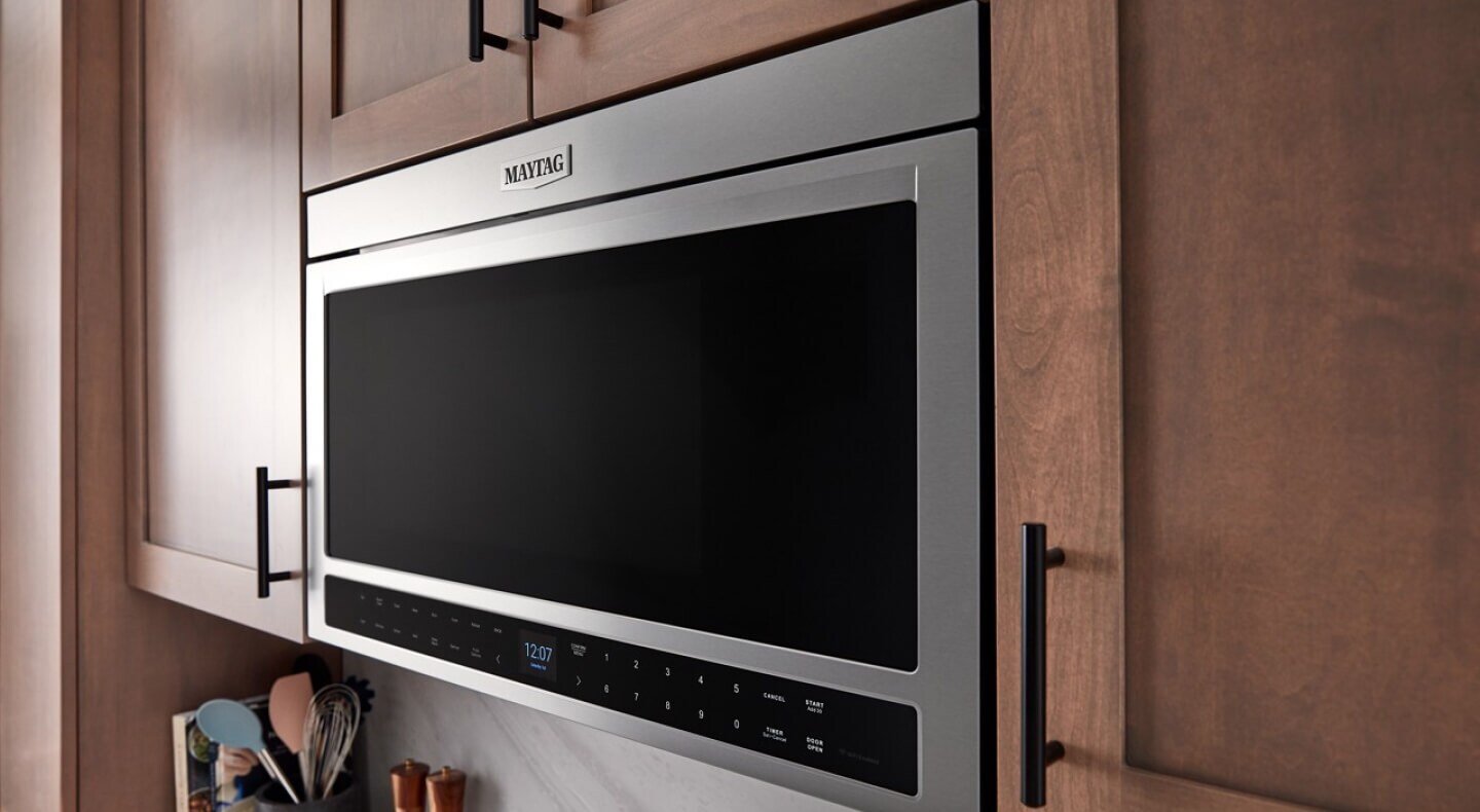 Over-the-range oven built into wood cabinetry