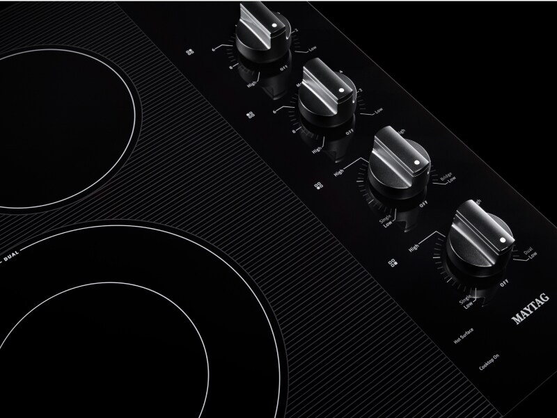 Glass electric cooktop burners and knobs Glass electric cooktop burners and knobs
