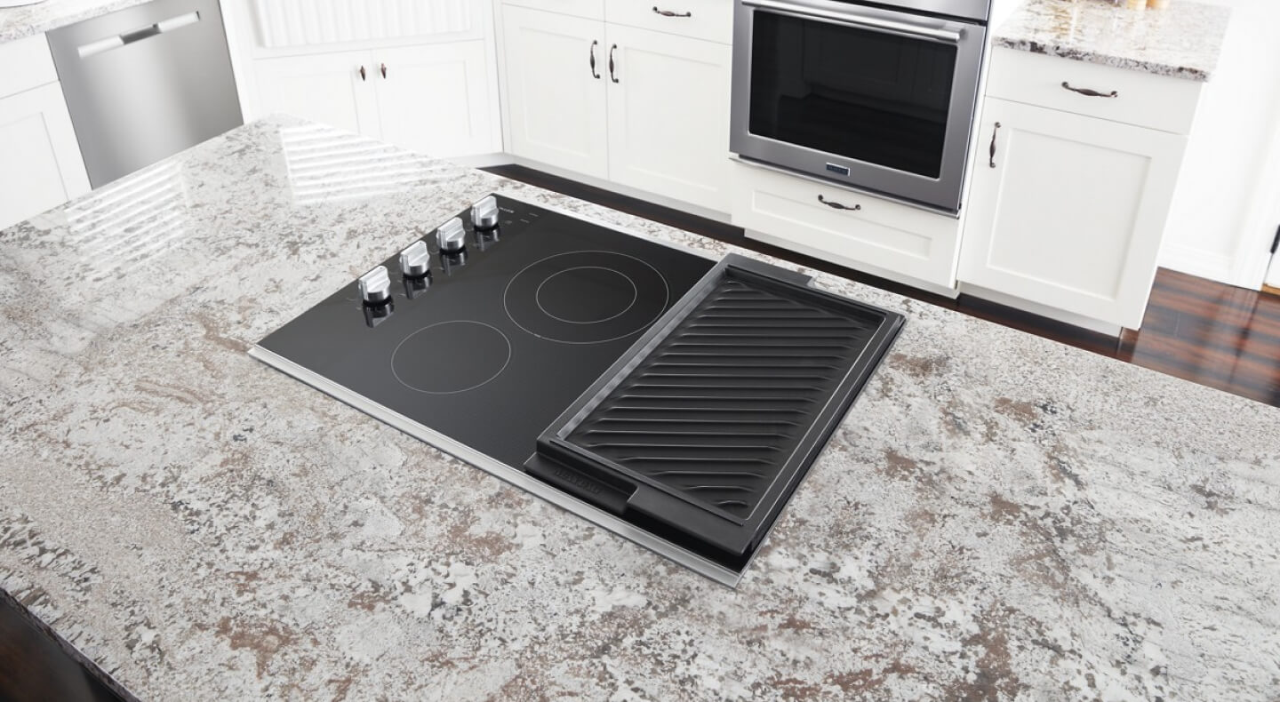  Maytag® electric cooktop installed in a kitchen island