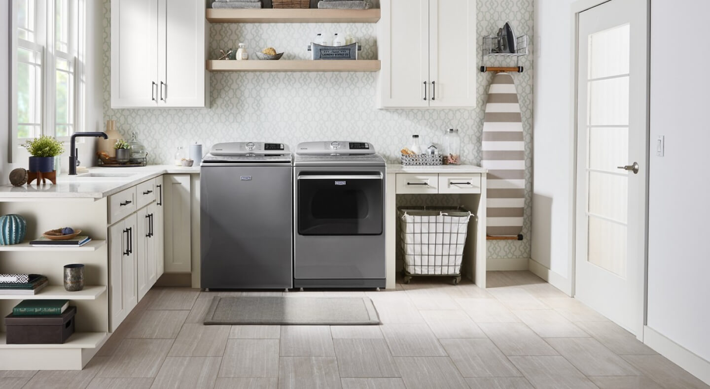 A Maytag® washer and dryer in a modern laundry room