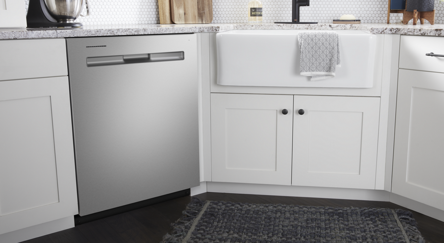 Maytag® dishwasher set in white cabinetry