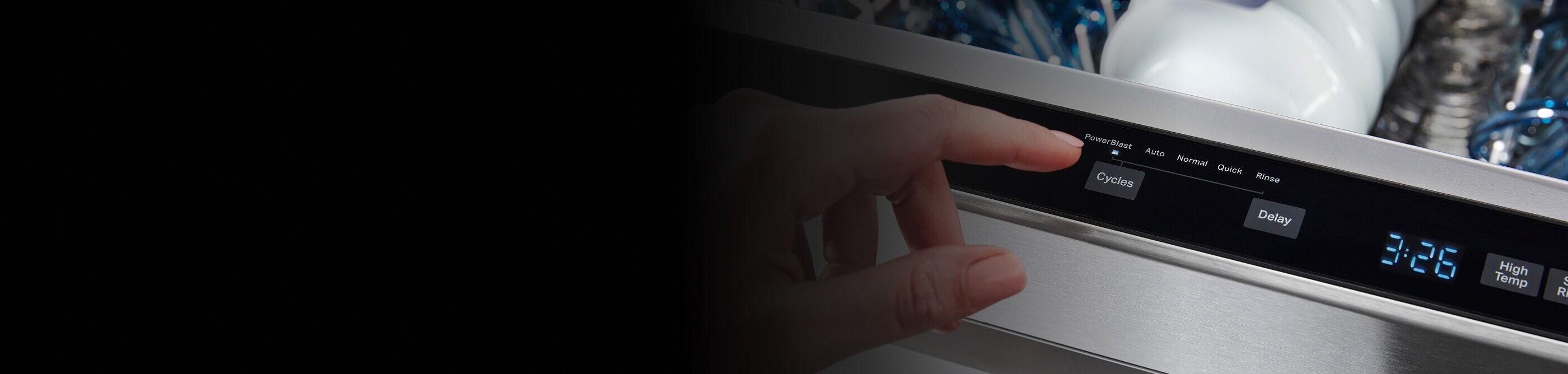 Person selecting cycle on a dishwasher