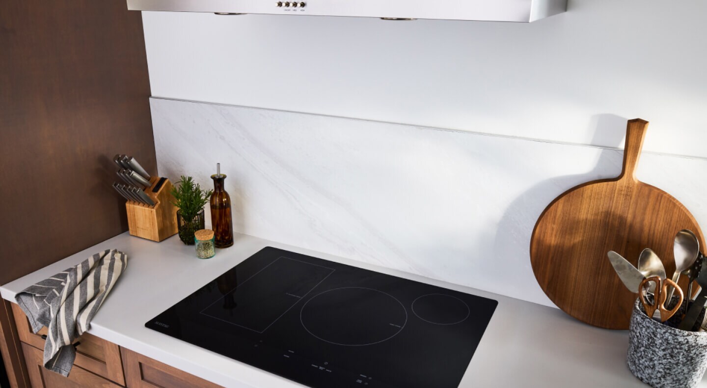 Maytag® induction cooktop in an off-white countertop