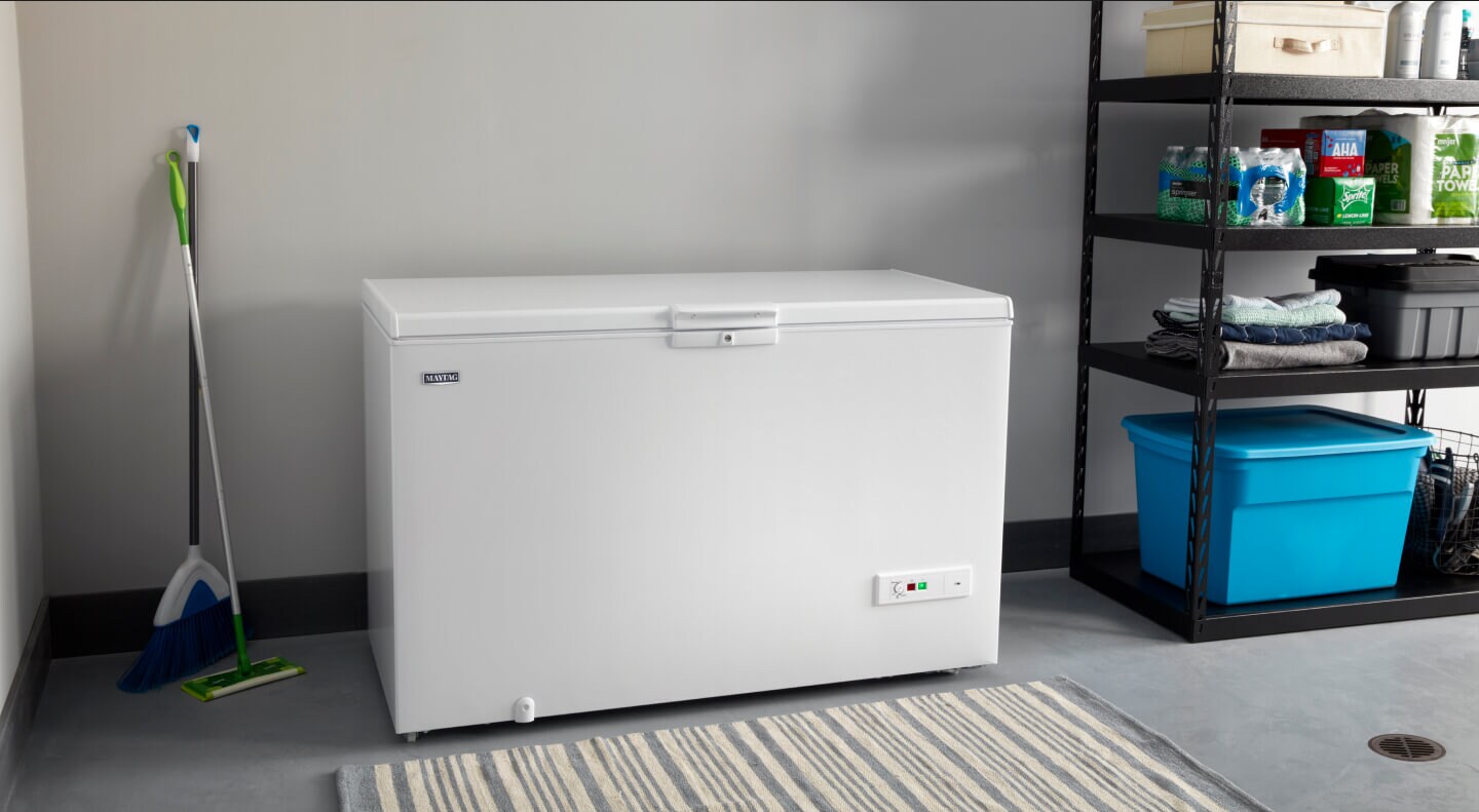 A Maytag® chest freezer in a garage