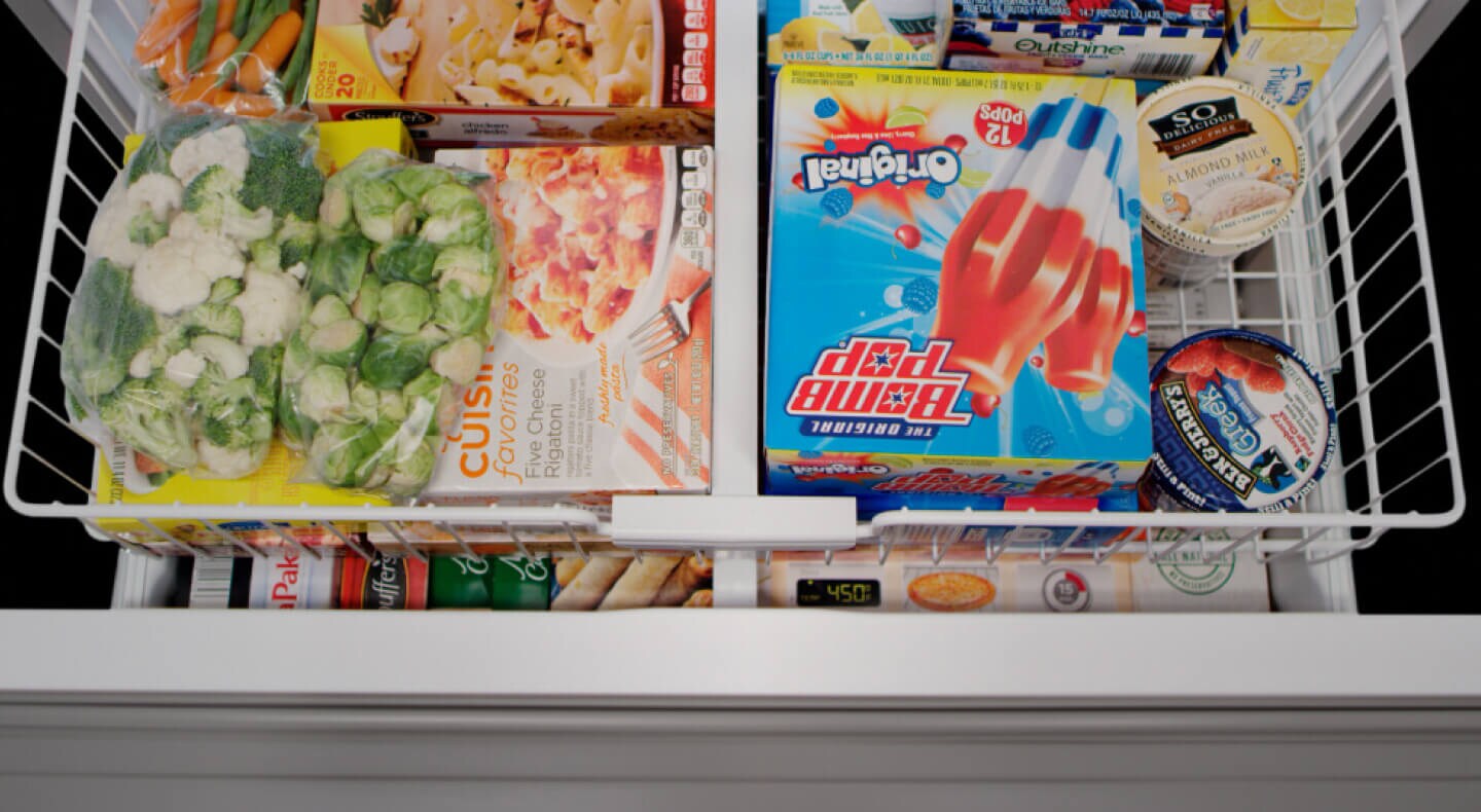 Close up of an open freezer drawer