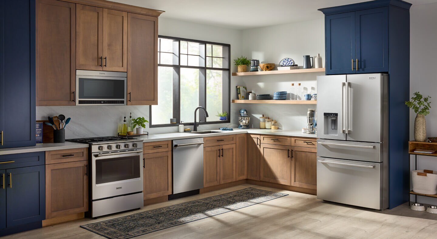 Maytag® French door refrigerator with an exterior drawer in blue and natural wood cabinetry