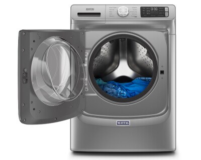 Maytag® front load washing machine with clothes inside