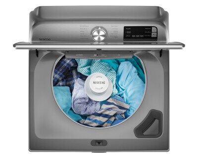 Maytag® top load washing machine with clothes inside