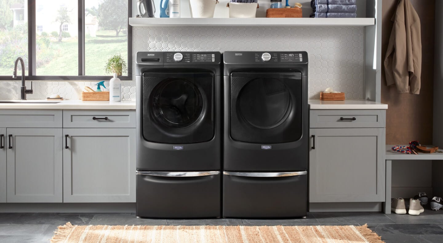 Maytag® front load washing machine and dryer on pedestals