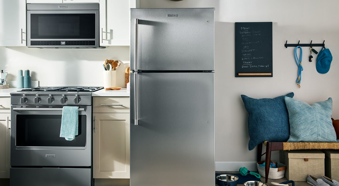 A Maytag® Top-Freezer Refrigerator with Garage Mode in a kitchen