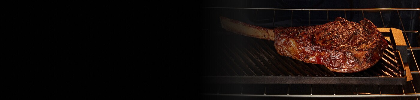 Steak grilling inside a Maytag® oven with Grill Mode