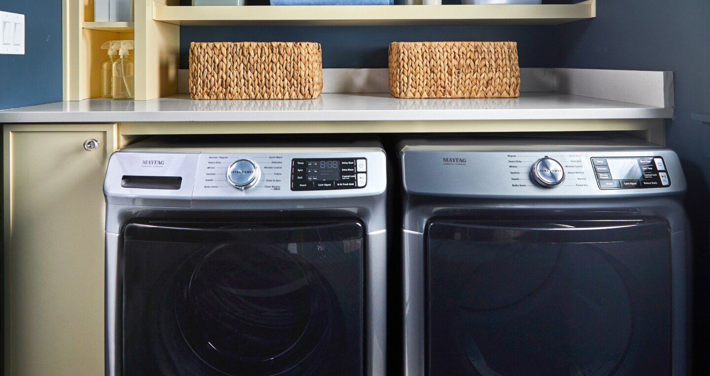 Maytag® front load washing machine and dryer in a bright laundry room