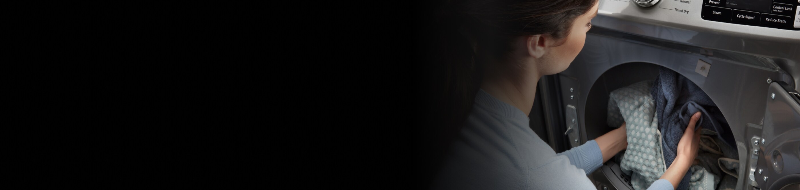 Unloading laundry from a Maytag® dryer.