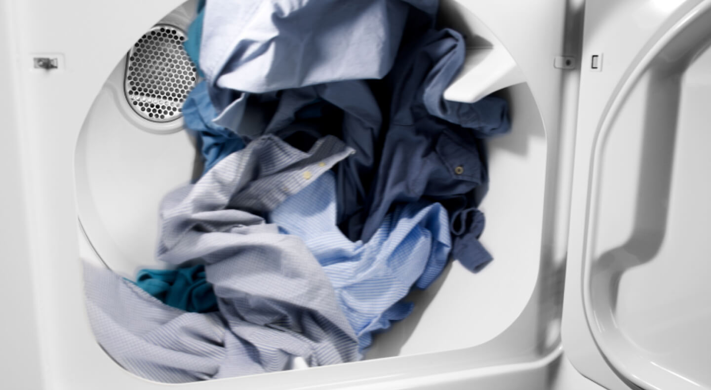 Blue clothes in a dryer.