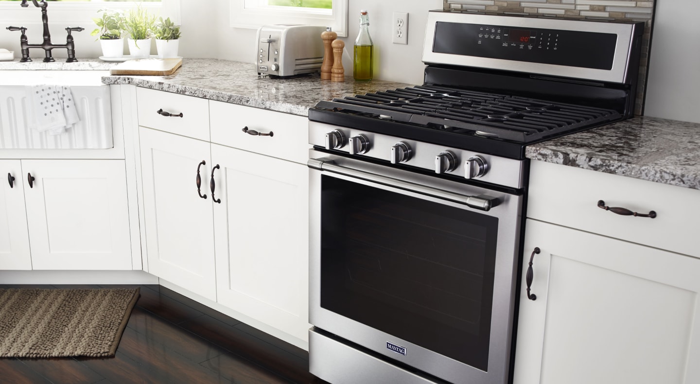 Interior shot of kitchen featuring Maytag® gas range. Interior shot of kitchen featuring Maytag® gas range.