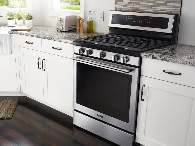 Interior shot of kitchen featuring Maytag® gas range. Interior shot of kitchen featuring Maytag® gas range.