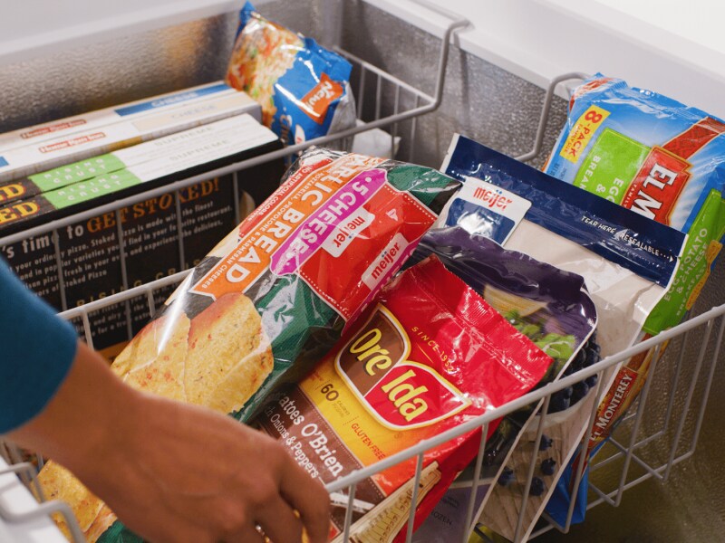 Close-up of frozen food in top freezer baskets of chest freezer Close-up of frozen food in top freezer baskets of chest freezer