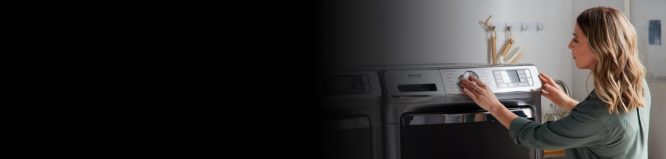 Person adjusting dryer settings