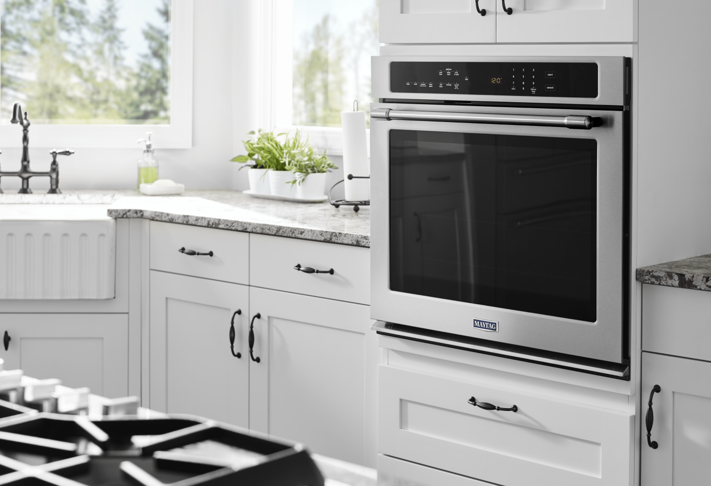 Maytag® in-wall oven in a bright, white kitchen Maytag® in-wall oven in a bright, white kitchen