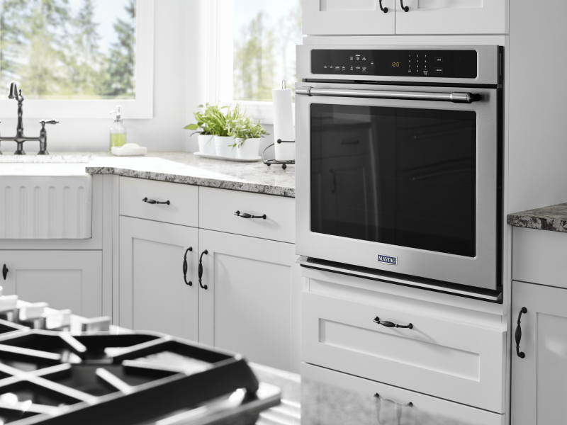 Maytag® in-wall oven in a bright, white kitchen Maytag® in-wall oven in a bright, white kitchen