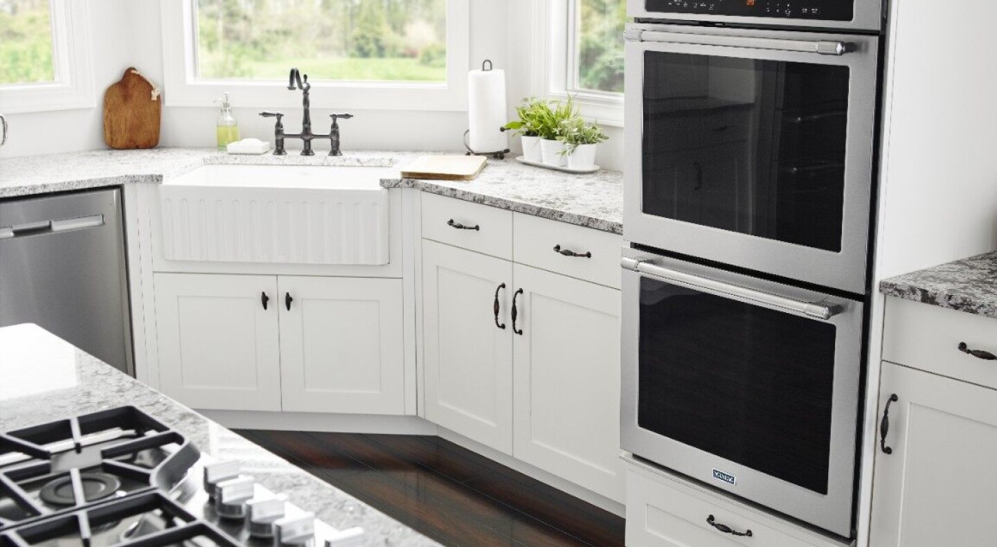 Farmhouse style kitchen featuring a double wall oven