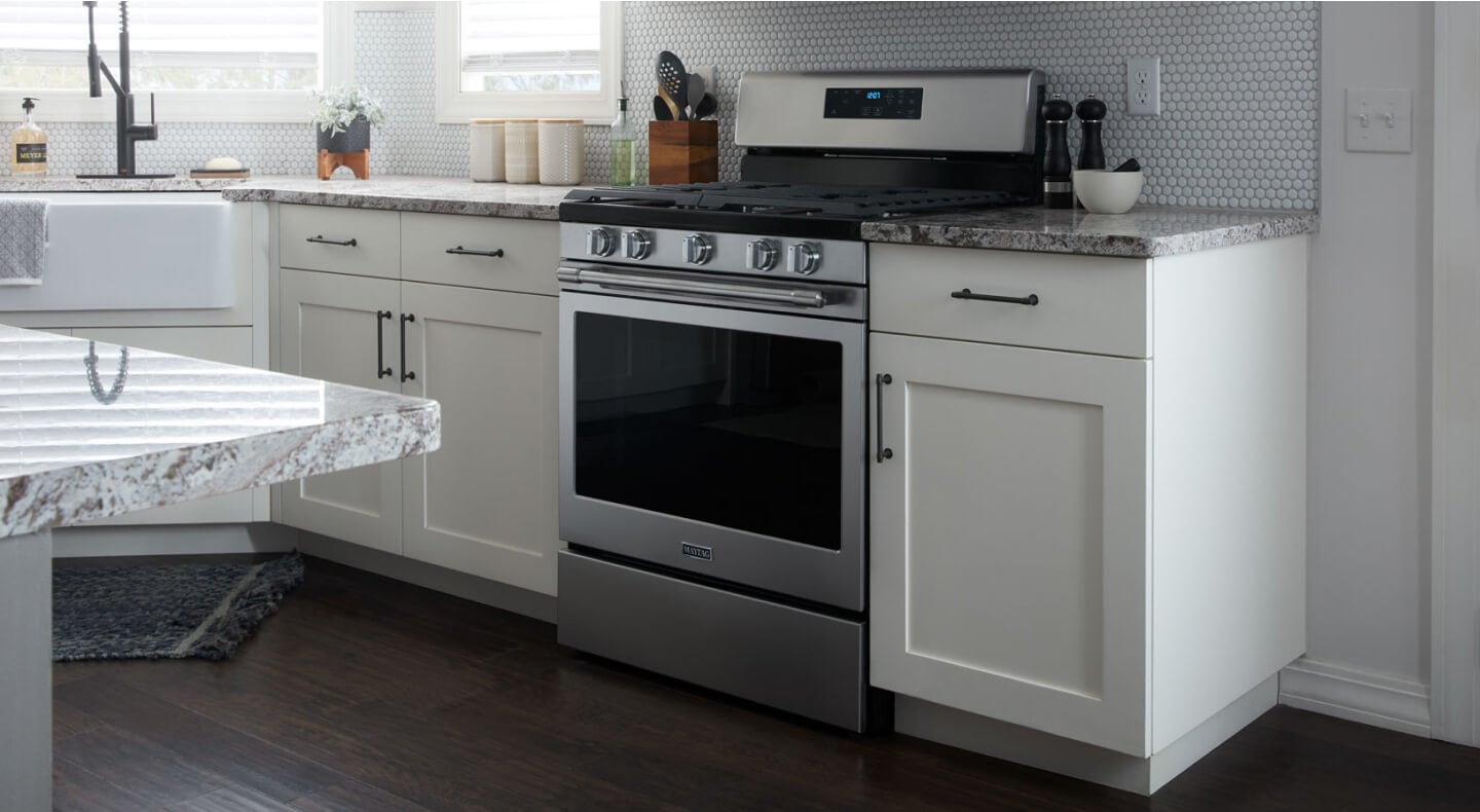 Maytag® range set in white cabinetry Maytag® range set in white cabinetry