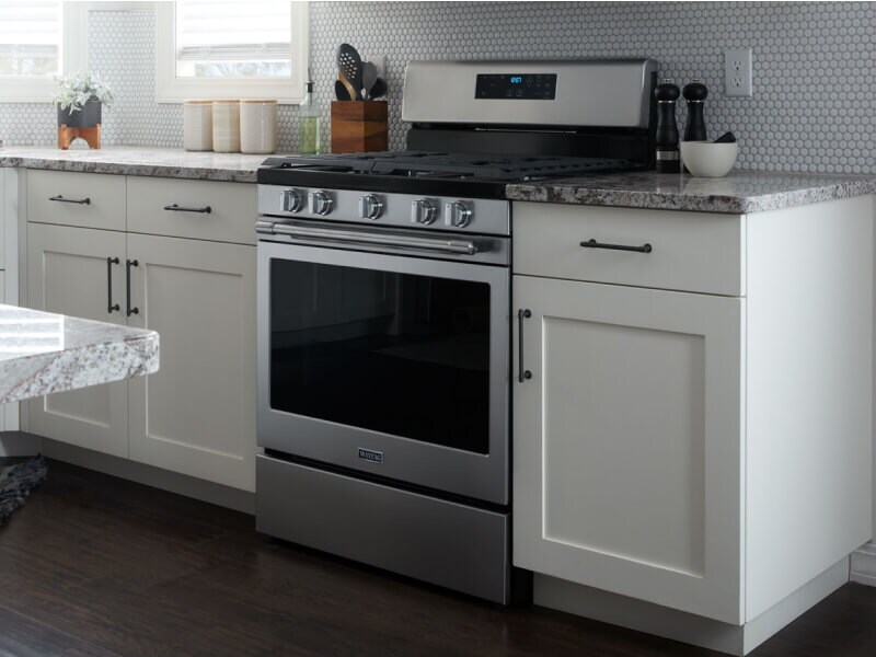 Maytag® range set in white cabinetry Maytag® range set in white cabinetry