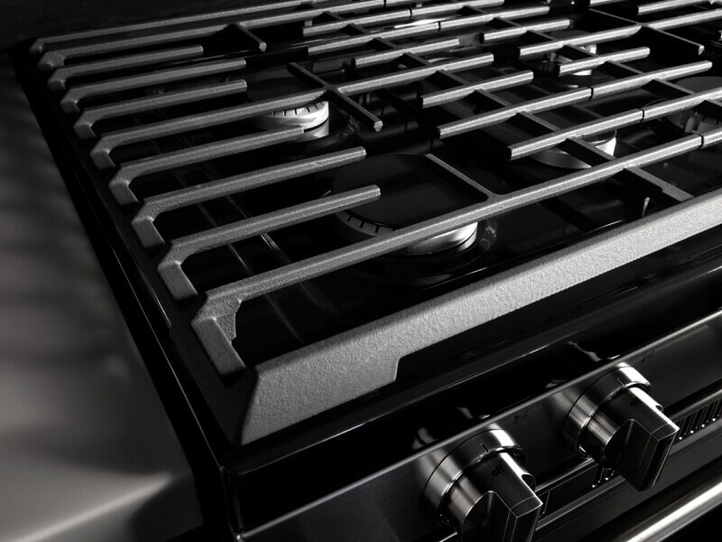 Close-up of iron grates on a gas cooktop