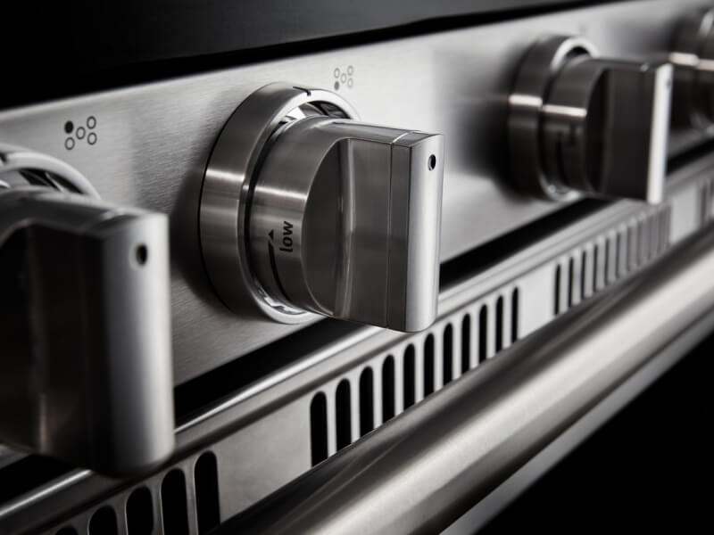 Close-up of control knobs for a gas stovetop