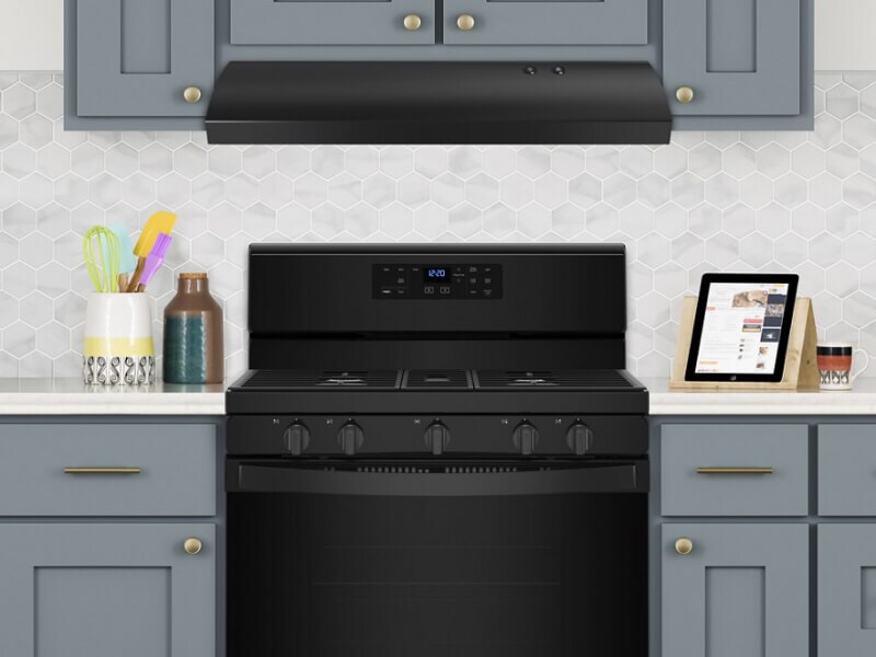 Under-canopy range hood above a black Maytag® gas range