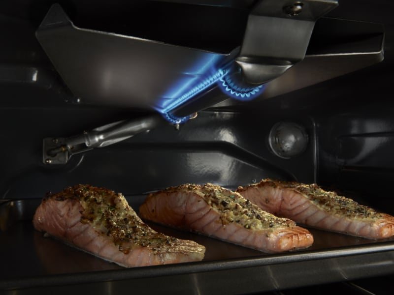 Three salmon filets cooking inside a Maytag® oven Three salmon filets cooking inside a Maytag® oven