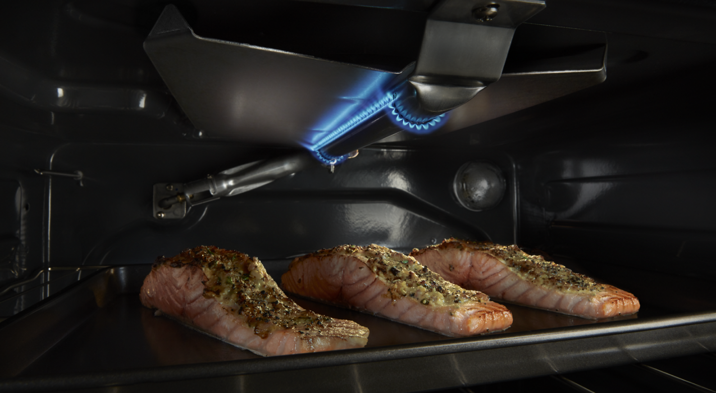 Three salmon filets cooking inside a Maytag® oven Three salmon filets cooking inside a Maytag® oven
