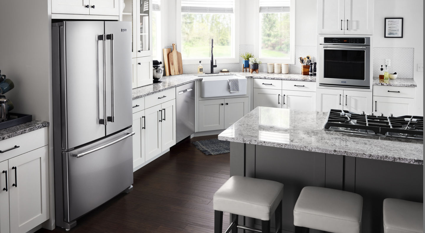 Stainless steel Maytag® appliances in a modern kitchen