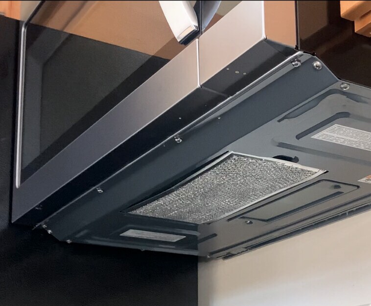View of the bottom of the microwave showing location of the grease filter