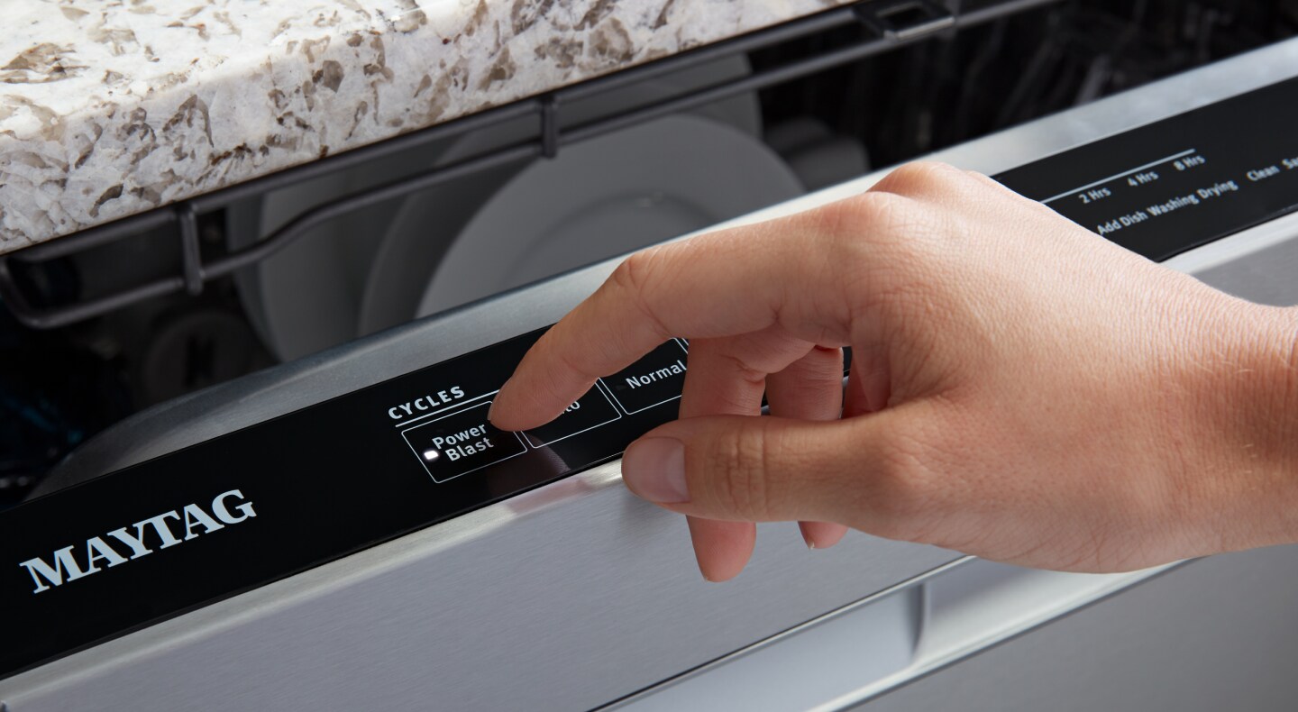 Person selecting the PowerBlast® cycle on a Maytag® dishwasher Person selecting the PowerBlast® cycle on a Maytag® dishwasher