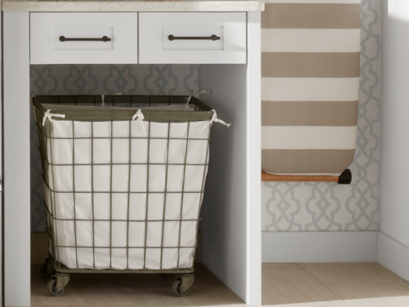 A laundry basket next to a Maytag® dryer in a modern laundry room. A laundry basket next to a Maytag® dryer in a modern laundry room.