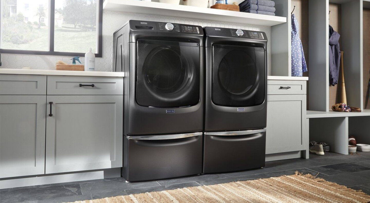 Maytag® washer and dryer in a laundry room.