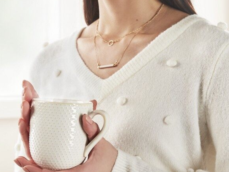 A person wearing a cashmere sweater A person wearing a cashmere sweater