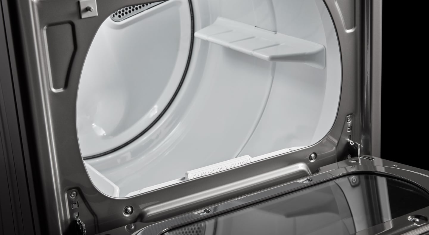 White interior dryer drum of a front load dryer White interior dryer drum of a front load dryer
