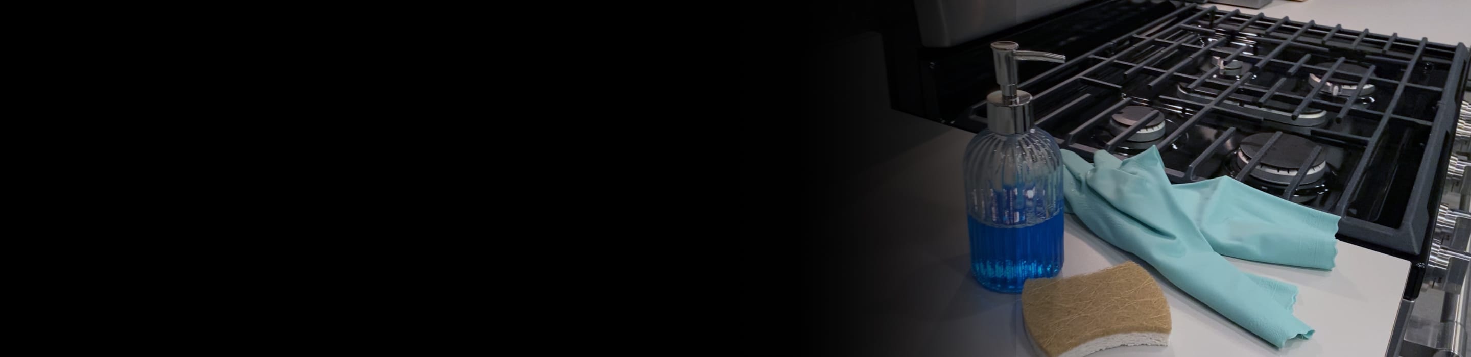 Cleaning supplies next to a gas range