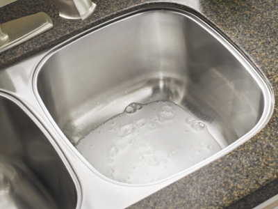 Kitchen sink with cleaner in it