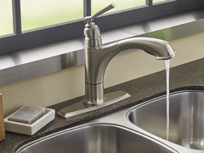 Kitchen sink with water running