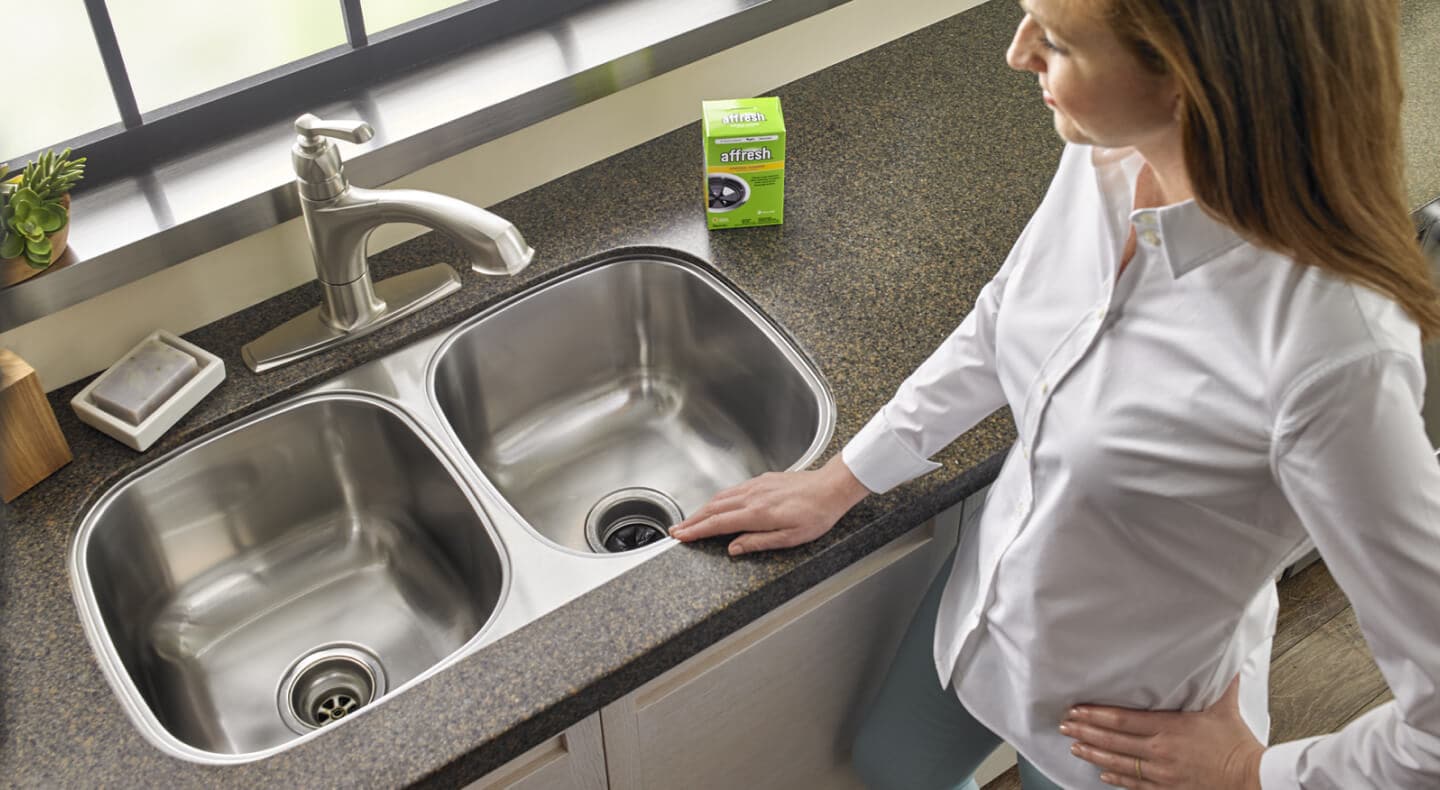 Affresh® on the counter next to a clean sink