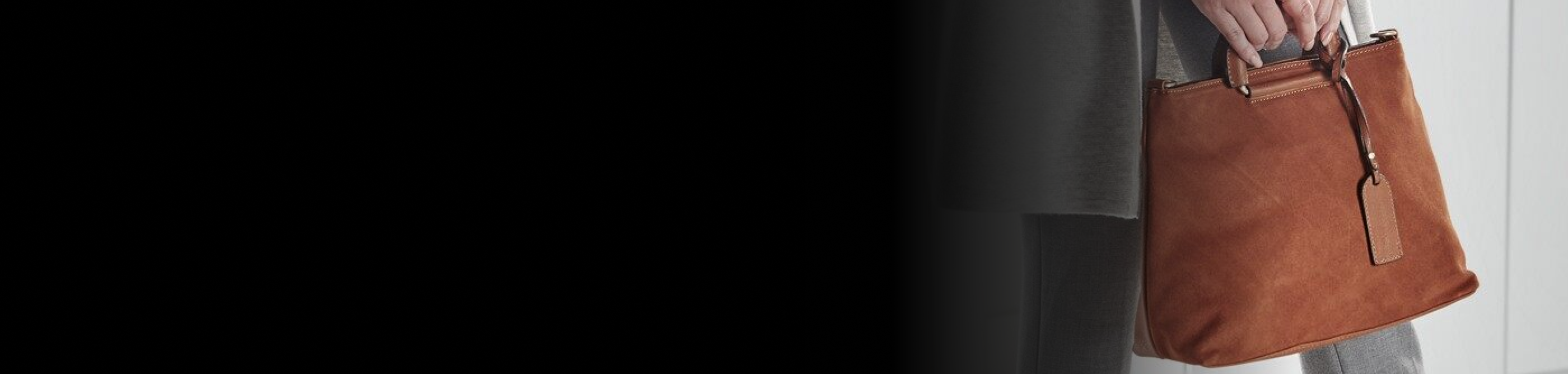 Person holding suede bag