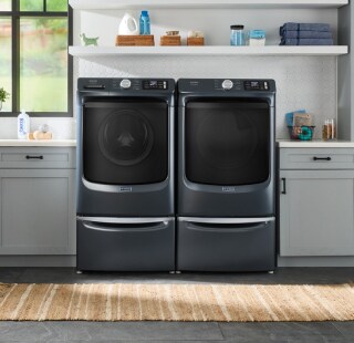 Front load washer and dryer on laundry pedestals