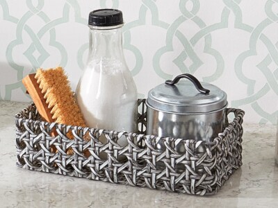Basket of cleaning ingredients on counter