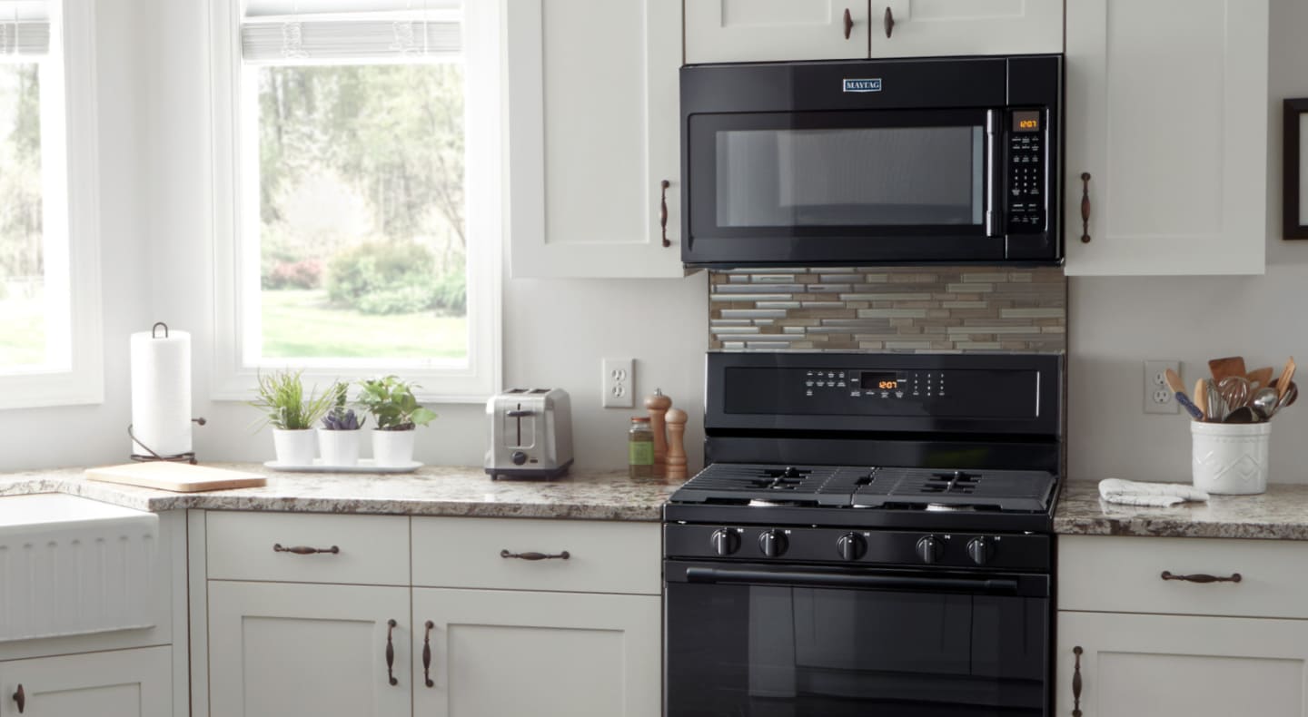 A Maytag® over-the-range microwave in a modern kitchen. A Maytag® over-the-range microwave in a modern kitchen.