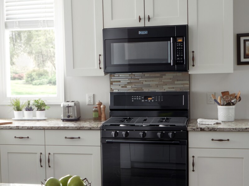 A Maytag® over-the-range microwave in a modern kitchen. A Maytag® over-the-range microwave in a modern kitchen.
