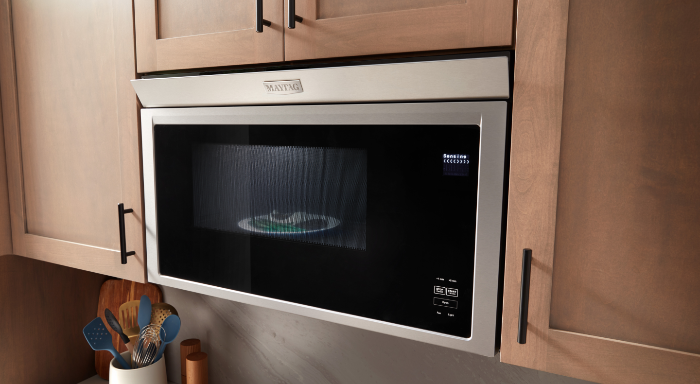 A closeup of a Maytag® over-the-range microwave.
