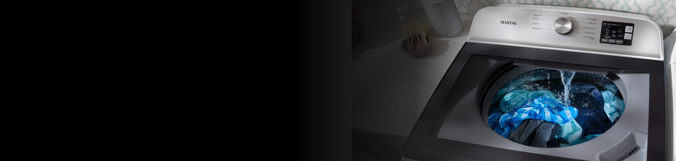 Clothes being washed in a Maytag® top load washing machine